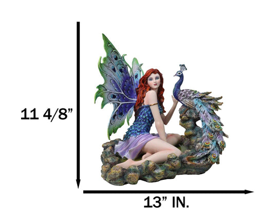 Large Fantasy Fairy With Blue Iridescent Train Wings Sitting By Peacock Statue