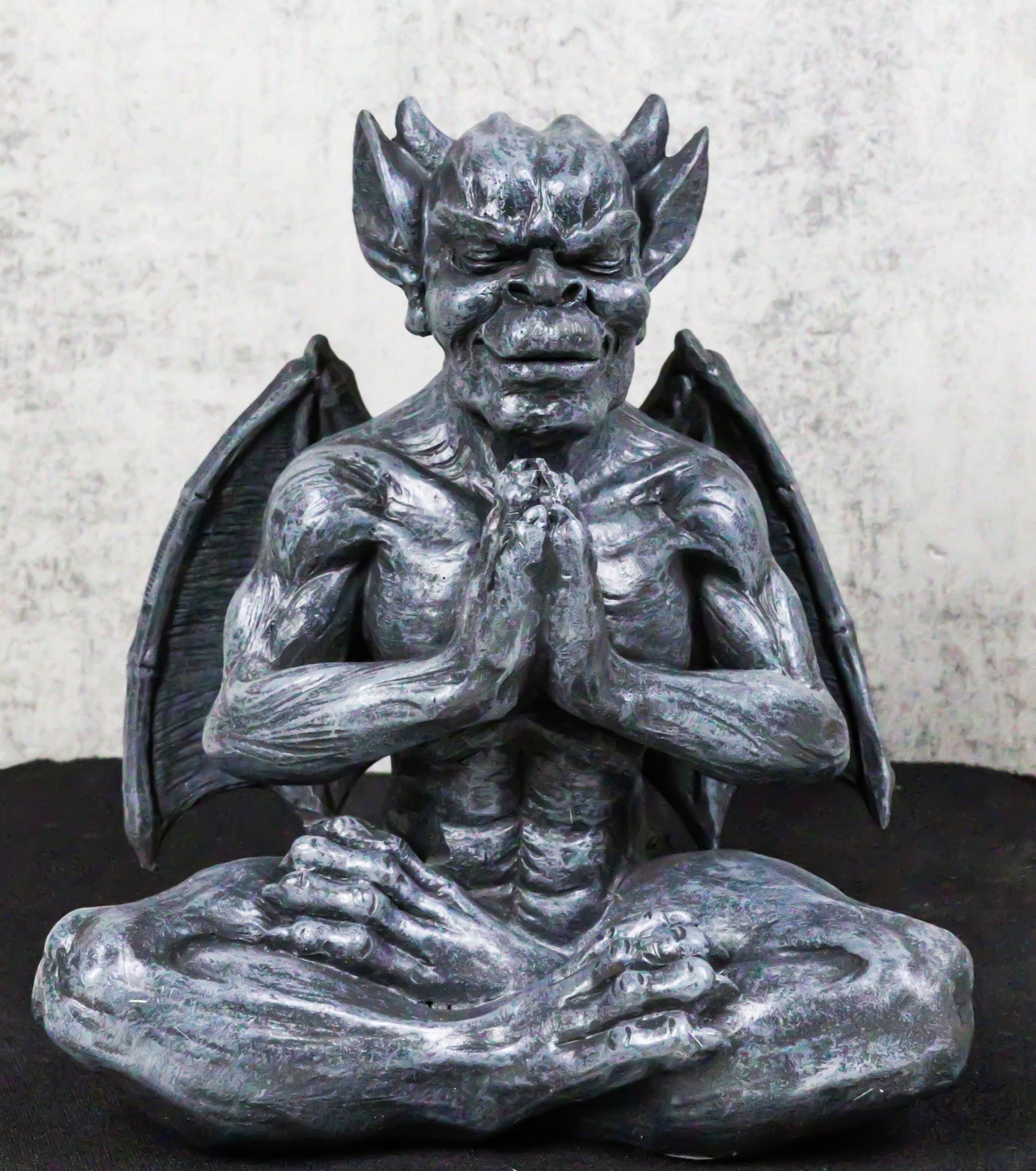Sitting Stoic Horned Gargoyle With Wings In Yoga Meditation Lotus