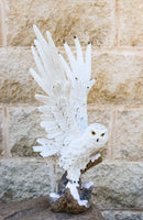 Large White Snowy Owl Figurine with Outstretched Wings on Snow-Covered Branch