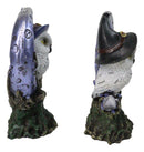 Pair of Snow Owls With Witch Hats Perching On Cratered Crescent Moon Figurines