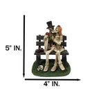 Skeleton Couple with Top Hat and Wig Sitting On Park Bench With Roses Figurine