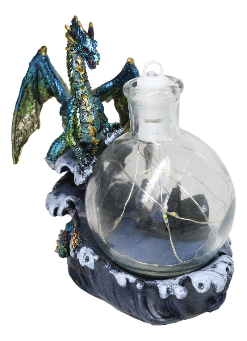 Metallic Frozen Sea Dragon Rising Above Waves by Glass Bottle With Ship Figurine