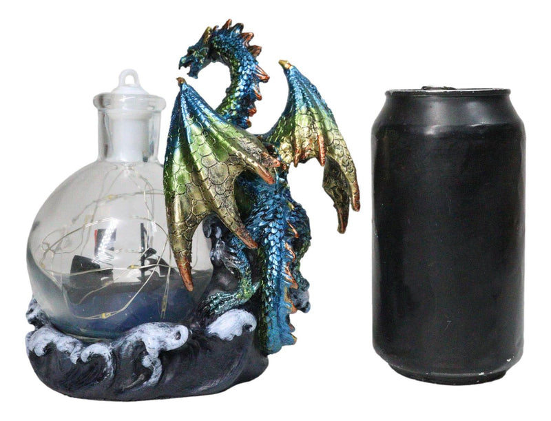 Metallic Frozen Sea Dragon Rising Above Waves by Glass Bottle With Ship Figurine