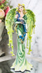 Beautiful Green Fairy With Colorful Flowers Carrying A Blue Peacock Figurine