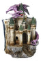 Purple Dragon Guarding LED Medieval Castle On Rocks With Book of Spells Figurine