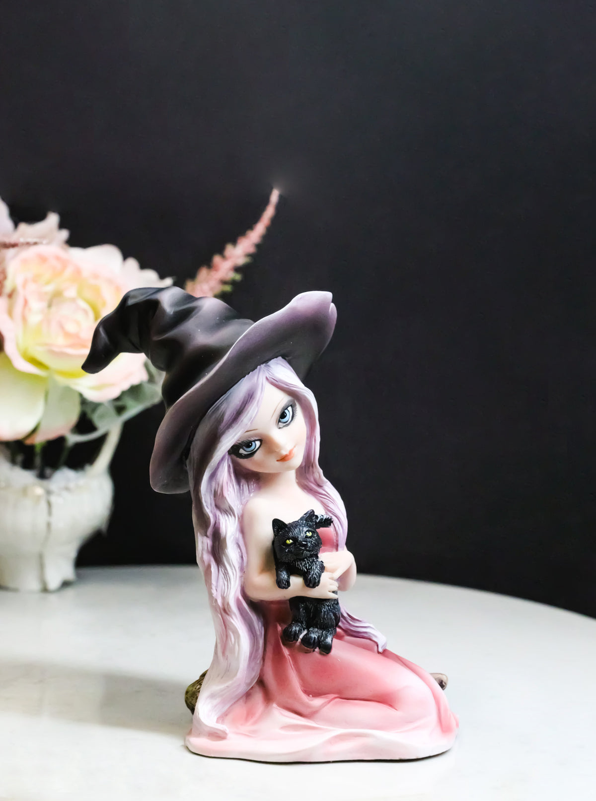 Gothic Beautiful Witch In Pink Dress And Magical Hat Holding Black Cat Figurine