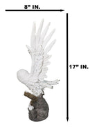Large White Snowy Owl Figurine with Outstretched Wings on Snow-Covered Branch