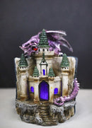 Purple Dragon Guarding LED Medieval Castle On Rocks With Book of Spells Figurine