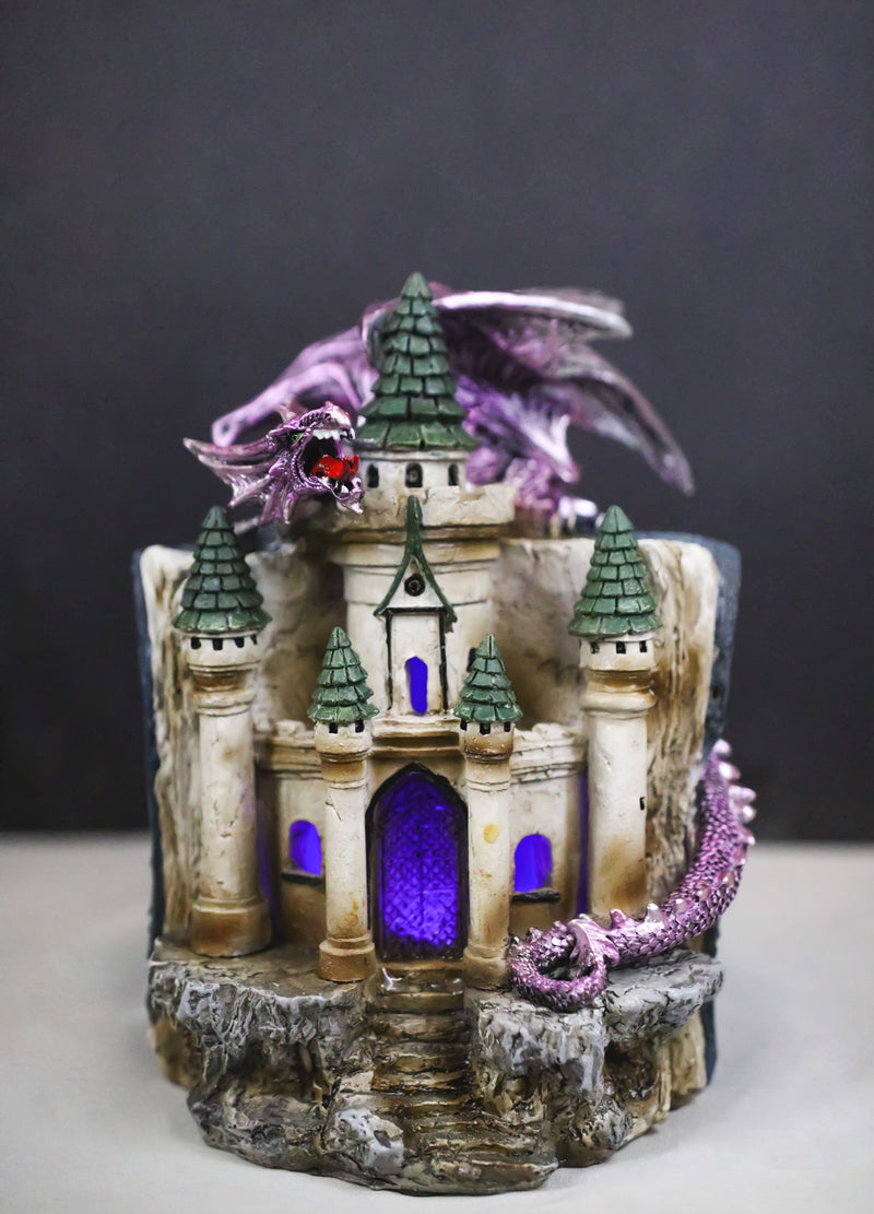 Purple Dragon Guarding LED Medieval Castle On Rocks With Book of Spells Figurine