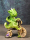 Fantasy Green Wyrmling Baby Dragon Riding A Wooden Log Cavebike Bicycle Figurine