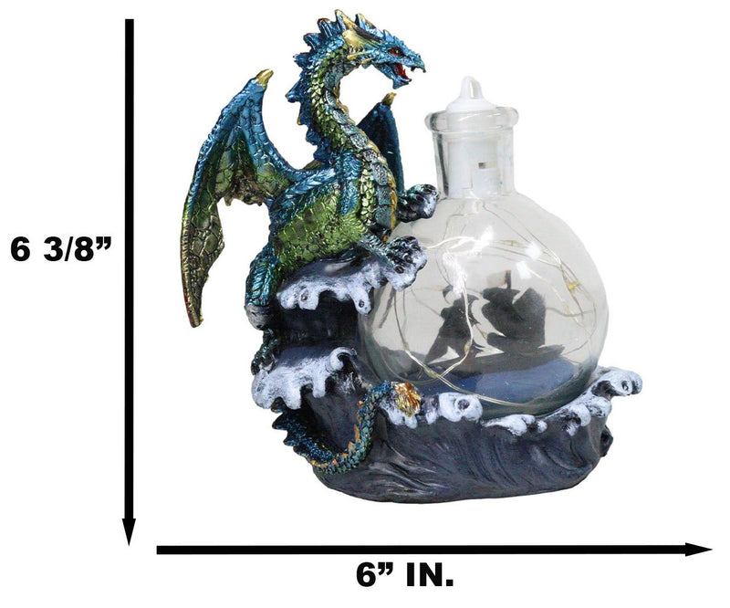 Metallic Sea Dragon Rising Above Waves by LED Glass Bottle With Ship Figurine