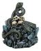 Coiled Attacking Snake On Mound of Skulls at Crystal Rock Quarry Figurine