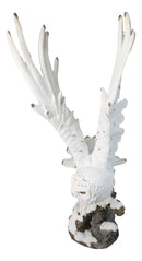 Large White Snowy Owl Figurine with Outstretched Wings on Snow-Covered Branch
