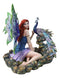 Large Fantasy Fairy With Blue Iridescent Train Wings Sitting By Peacock Statue