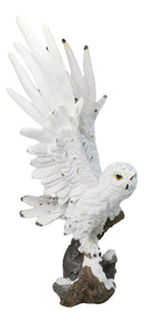Large White Snowy Owl Figurine with Outstretched Wings on Snow-Covered Branch