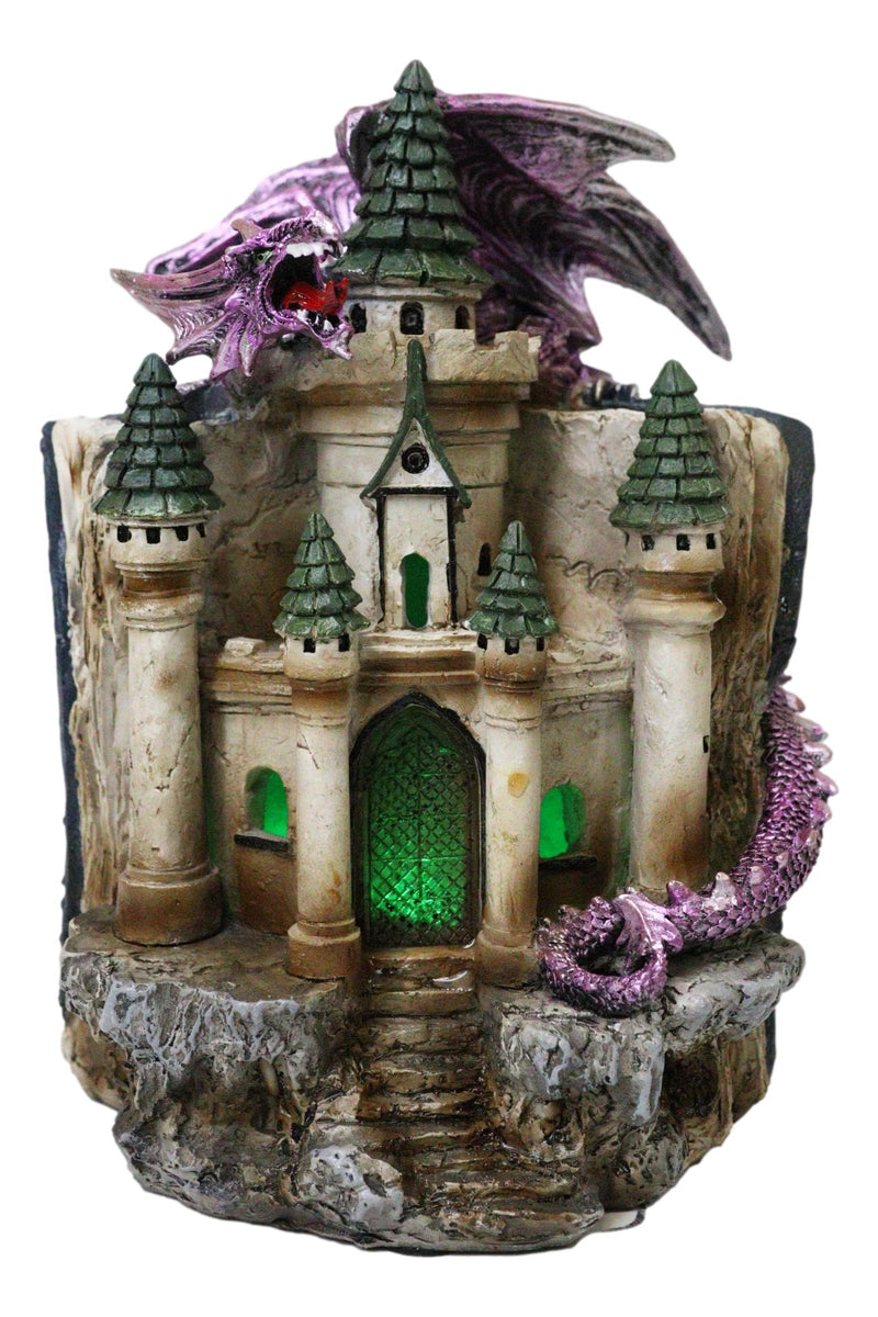 Purple Dragon Guarding LED Medieval Castle On Rocks With Book of Spells Figurine