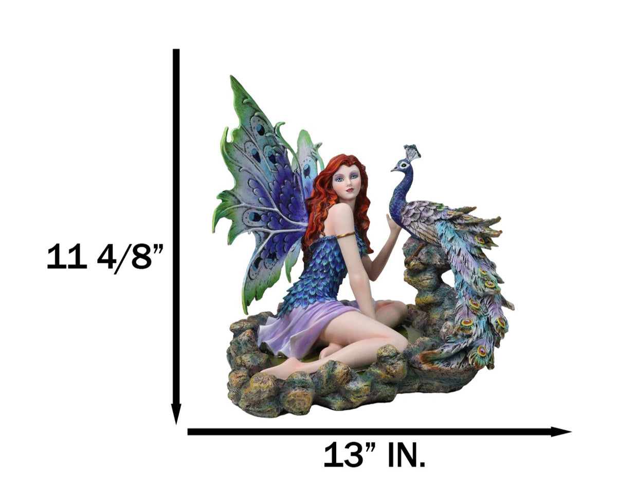 Large Fantasy Fairy With Blue Iridescent Train Wings Sitting By Peacock Statue