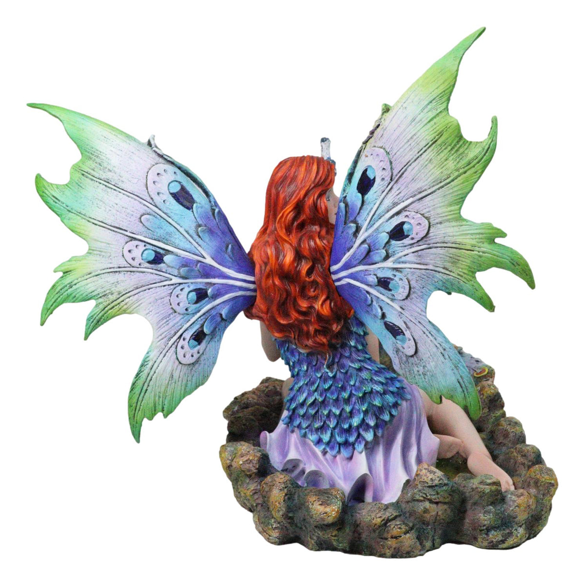Large Fantasy Fairy With Blue Iridescent Train Wings Sitting By Peacock Statue