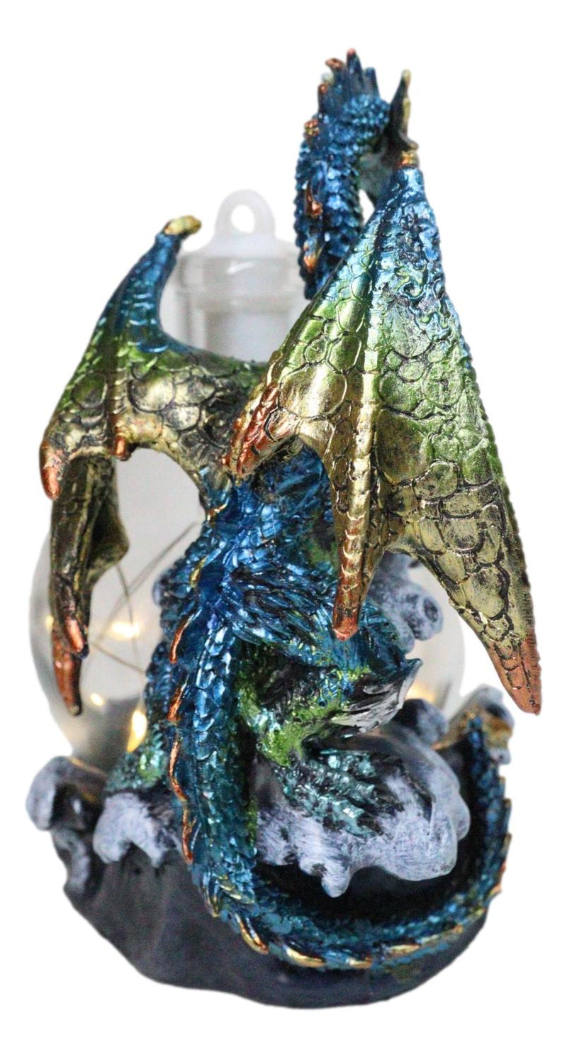 Metallic Sea Dragon Rising Above Waves by LED Glass Bottle With Ship Figurine