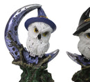 Pair of Snow Owls With Witch Hats Perching On Cratered Crescent Moon Figurines