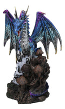 Metallic Blue Dragon with Purple Spikes Perching On Oversized Skull Figurine