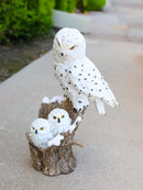 Snowy Owl Mother with Two Owlets Family Figurine on Snow-Covered Tree Stump