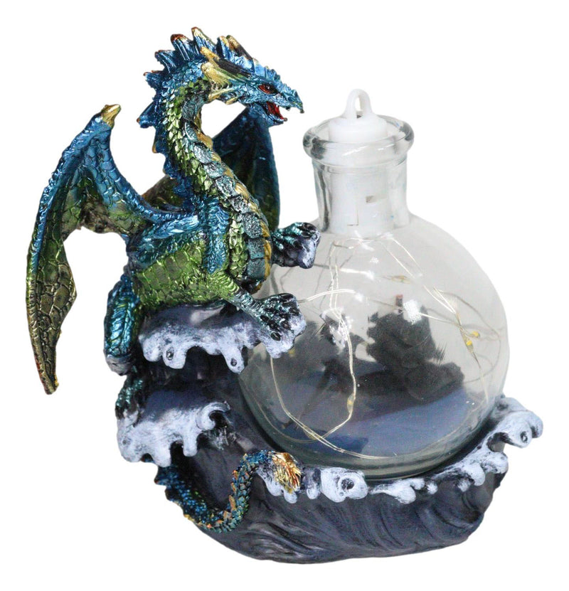 Metallic Frozen Sea Dragon Rising Above Waves by Glass Bottle With Ship Figurine