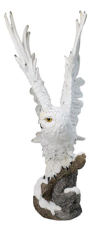Large White Snowy Owl Figurine with Outstretched Wings on Snow-Covered Branch