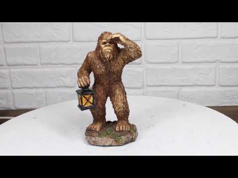 Bigfoot Hiker Holding Lantern Figurine | Ebros Gift