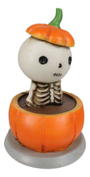 Lucky The Skeleton Jack O Lantern Bathing in Chocolate Soup Pumpkin Figurine