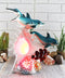 Ebros Nautical Ocean Family 3 Dolphins Swimming Over Giant Sea Conch Clownfishes and Anemones Statue with Colorful LED Light 9.5" Tall