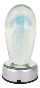 Ebros Glow In The Dark Light Blue Jellyfish 6"H Glass Egg With Color LED Base
