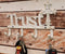 Cast Iron Rustic White Le Fleur Cross with Trust Letters Sign 4 Pegs Wall Hooks