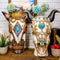 Set Of 2 Southwest Cow Skull With Turquoise Rocks And Braided Ropes Floral Vases