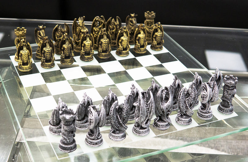 Dragon chess set with black and white dragons on a stone board Dragon chess set with black and white dragons on a stone board