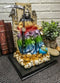 Ebros Rainbow Robe Holy Santa Muerte Seated On Throne with Scythe Statue 10.5"H