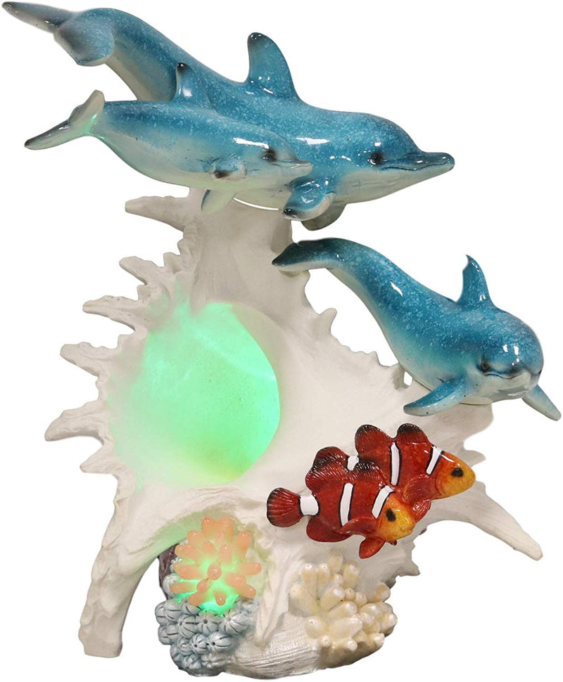 Ebros Nautical Ocean Family 3 Dolphins Swimming Over Giant Sea Conch Clownfishes and Anemones Statue with Colorful LED Light 9.5" Tall