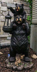 Ebros Rustic Black Bear Carrying Cub On Shoulder Statue 18.75"Tall With Solar LED Lantern Light Bear Family Guest Greeter"This Little Light Of Mine" Realistic Wildlife Black Bear Decor