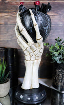 Gothic Alchemy Skeleton Hand Holding Black Anatomy Heart With Evil Eye Figurine