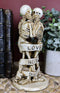 Ebros Skeleton Couple Kissing Wrapped by Censoring Ribbon Figurine 6.75" Tall