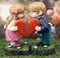 Ebros Love at First Sight Boy & Girl Kissing and Holding Split Red Heart Statue