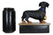 Award Trophy Dachshund Puppy Dog With Gold Medal Standing On Stage Figurine
