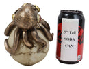 Ebros Sea Monster Golden Masked Octopus Wrapped Around Cyborg Robot Skull 5.25"H