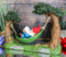 Ebros Whimsical Bookworm Gnome Sleeping On Hammock by Toadstool Mushrooms Forest Tree Ents Statue 6.5" Wide