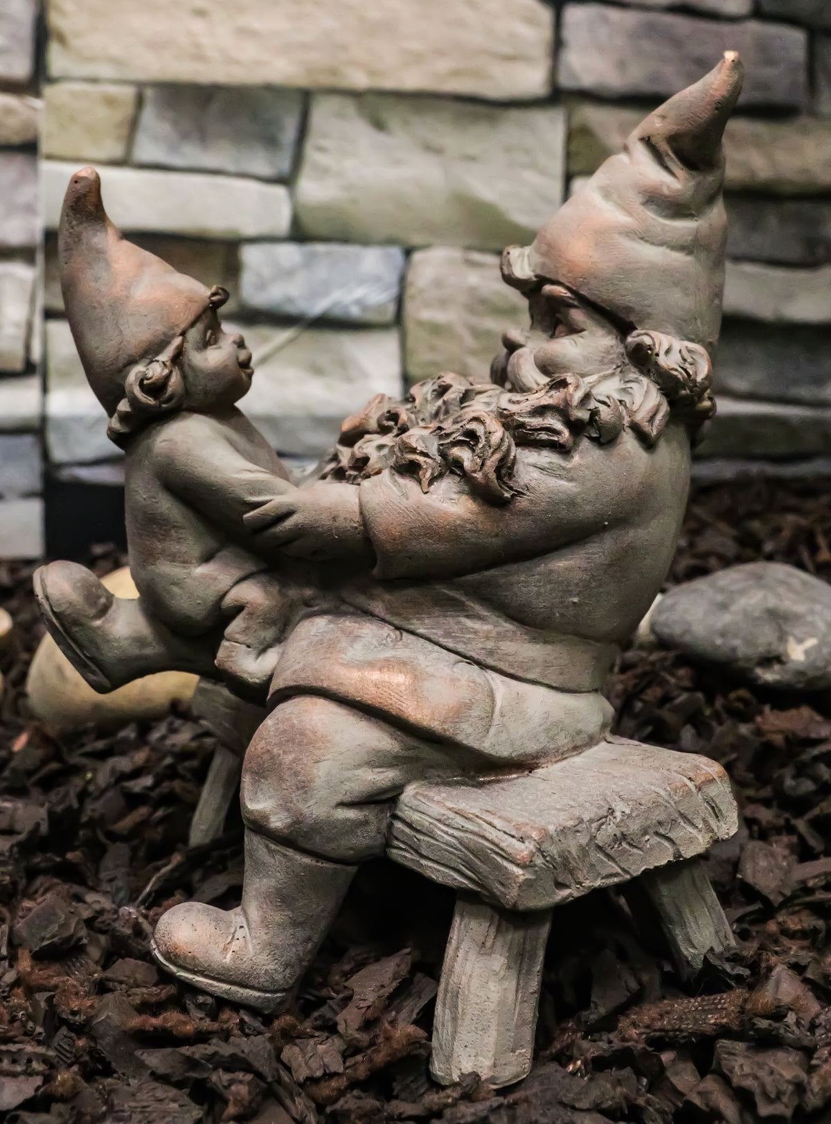Family Bonding Papa Gnome With Baby Gnome Sitting On Wooden Stool Garden Statue - Ebros Gift