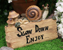 Helix Shell Snail By Mushrooms On Trunk Log With Slow Down Enjoy Sign Figurine