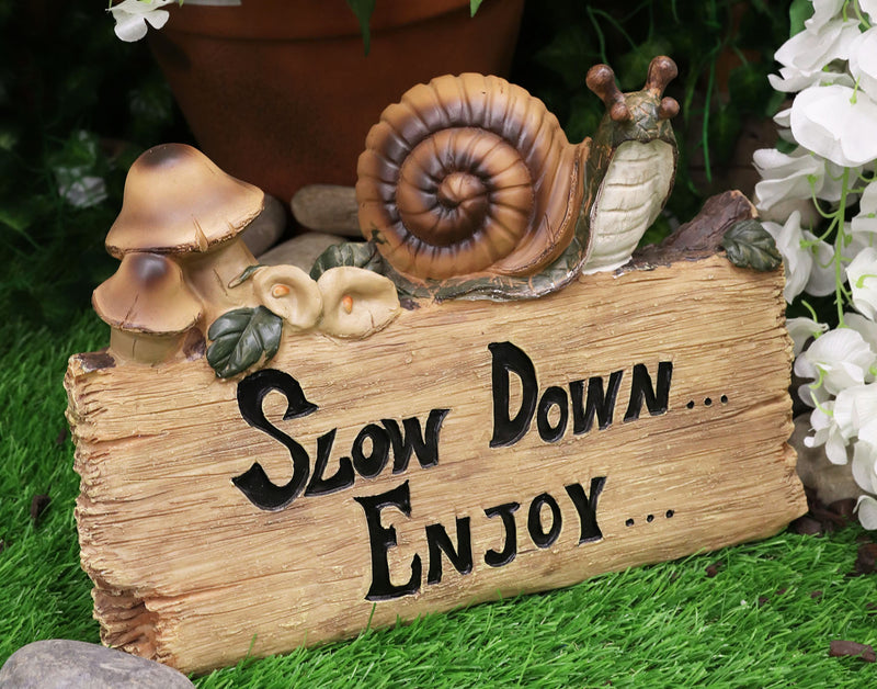 Helix Shell Snail By Mushrooms On Trunk Log With Slow Down Enjoy Sign Figurine