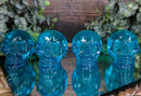 Set Of 4 Blue Translucent Witching Hour Gazing Skull Acrylic Miniature Figurines