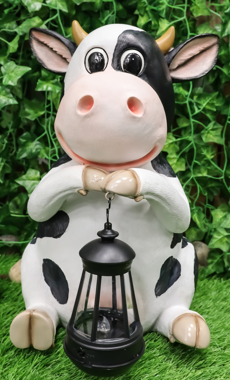 Ebros Country Farm Whimsical Holstein Cow Statue Holding Solar LED Lantern Light 14"H